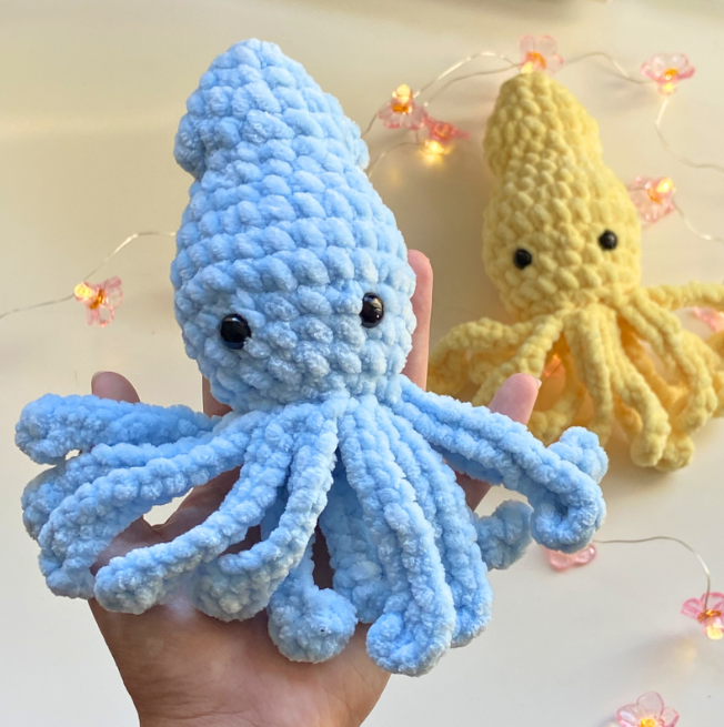a squid crochet plush made with chenille yarn. Free squid crochet pattern