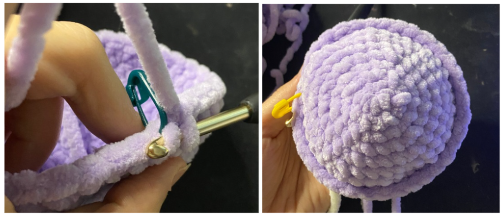 Purple textured amigurumi turtle shell showing the front loops only (FLO) round and openings for the fins.