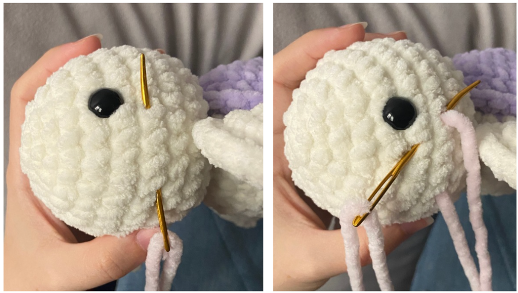 Close-up of crochet turtle head with safety eyes inserted between rounds and fiberfill stuffing visible.
