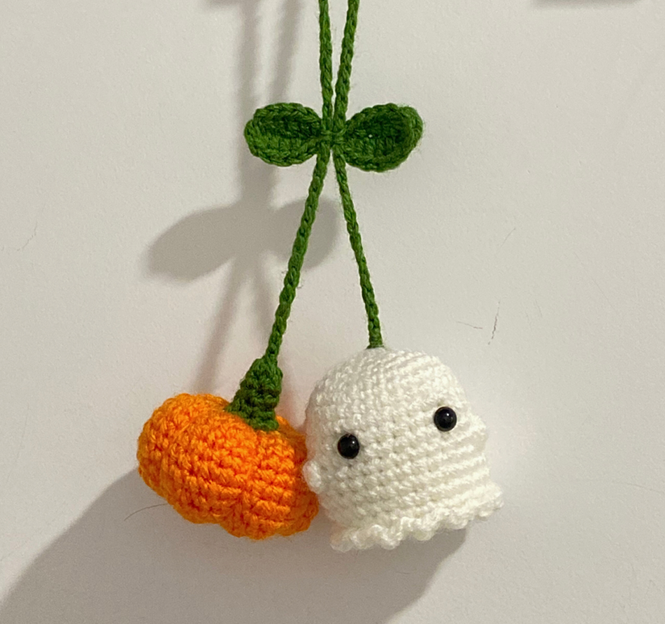 Free crochet pumpkin and ghost car hanger finished project hanging.