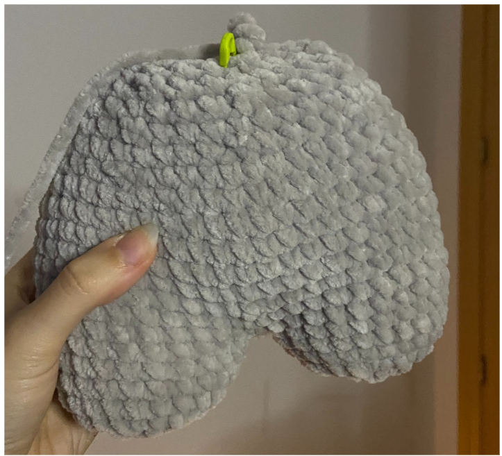 Crochet steps showing two individual plush hippo legs joined together to form the seamless main body.