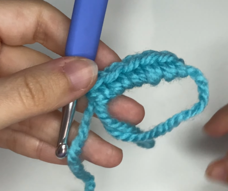 Completed amigurumi magic ring tightly closed with no gaps using crochet.