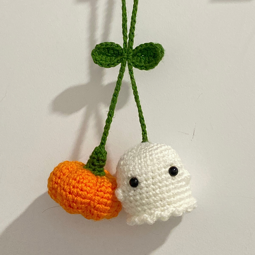 Free crochet pumpkin and ghost car hanger finished project hanging.