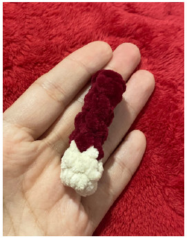 Step-by-step crochet tutorial showing how to attach the arms and textured beard for a Christmas gnome amigurumi.