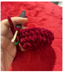 Step-by-step crochet tutorial showing how to attach the arms and textured beard for a Christmas gnome amigurumi.