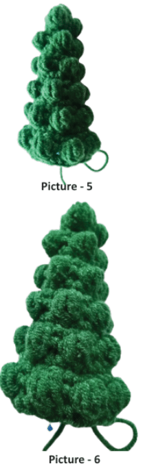 Close-up of a green crochet Christmas tree in progress showing the detailed rows of 6-loop bobble stitches.