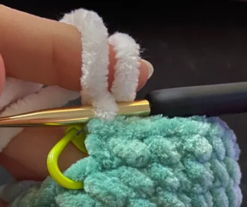 Step by step crochet duck head in green yarn showing color change to white ring and brown body.